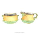 A matching Victorian Royal Worcester milk jug and sugar bowl, both with sterling silver rims