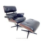 A black leather and plywood contemporary designer chair, with the matching stool