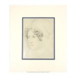 A 19th century pencil and crayon study of a young lady's head; unframed but mounted; sight size 20cm