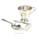 A cased, sterling silver child's spoon and pusher with a sterling silver Christening mug