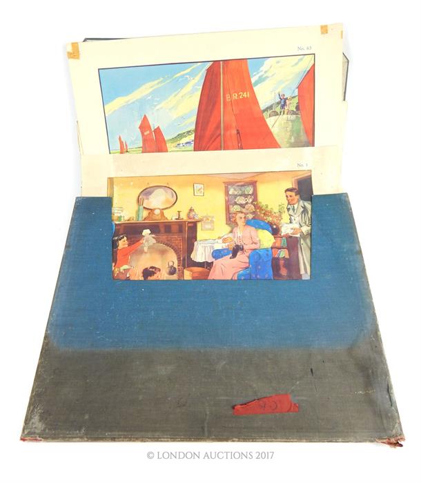 A blue cloth folio containing 77 original, colour, 1920's/1930's childhood prints