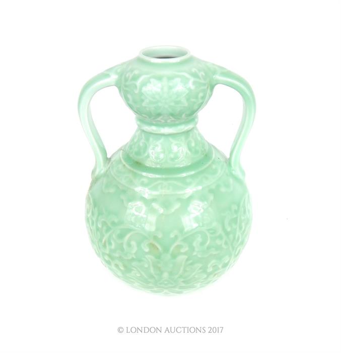 A large, twin-handled, celadon-glazed vase - Image 2 of 3