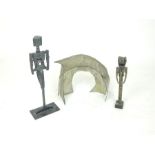 Two roughly cast and abstract base metal figurines, tallest (42cm high) together with a an