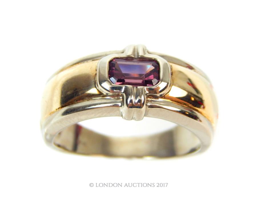 A 9 ct yellow and white gold, ruby-set ring