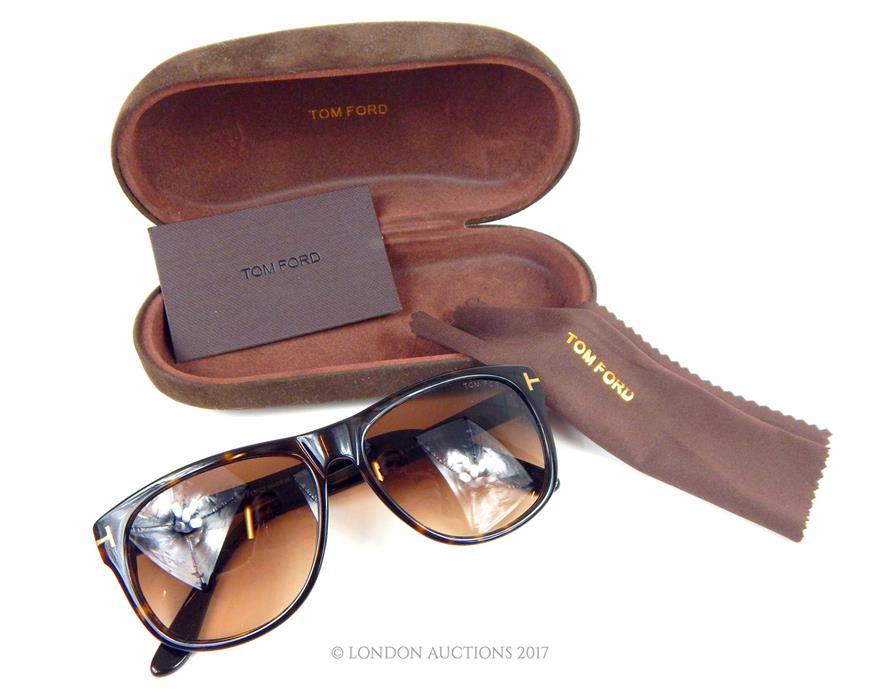 A pair of unused, Tom Ford, designer sunglasses in original Tom Ford brown suede case