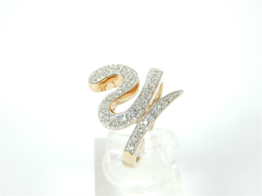 A fine, 9 ct yellow gold snake ring set with small, brilliant-cut diamonds