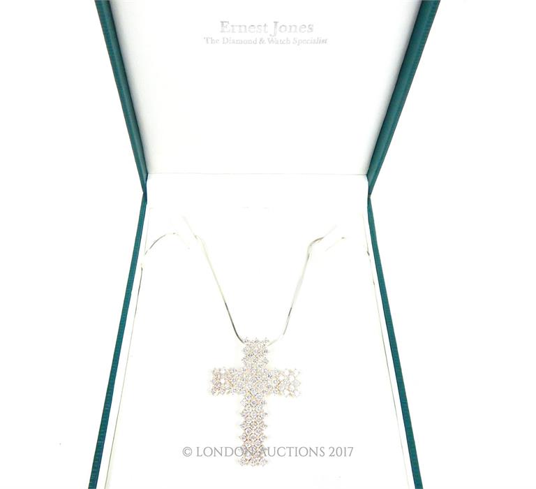 A boxed, Ernest Jones, sterling silver and white crystal cross pendant and chain