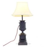 A 19th century black marble urn table lamp; overall height including shade 58cm.