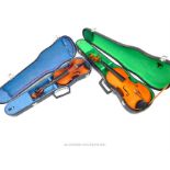 Two student's violins in hard cases