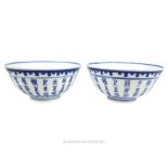 A pair of Chinese, porcelain, blue and white rice bowls (Kanxi period)