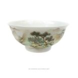 A Chinese porcelain bowl, hand painted with a mountainous landscape scene