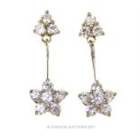 A pair of 18 ct white gold and diamond flower-head drop, stud earrings