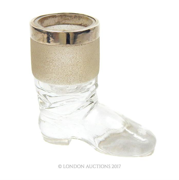 A late Victorian novelty glass match holder in the form of a boot, with a sterling silver collar