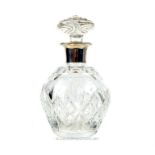 A crystal decanter with a sterling silver collar, Goldsmiths & Silversmiths Co Ltd