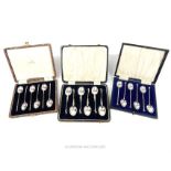 Three cased sets of six silver teaspoons