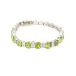 A sterling silver, peridot and white crystal bracelet