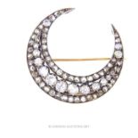 An exquisite, antique, large, diamond, crescent brooch