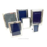 A collection of six sterling silver photograph frames