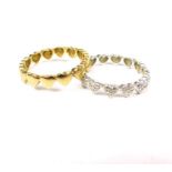 A charming pair of 9 ct yellow and white gold, heart rings