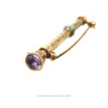 A Victorian, engraved, extending pencil pin-brooch in yellow metal set with turquoise and amethyst