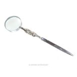 An Edwardian sterling silver magnifying glass, incorporating a stainless steel letter opener