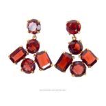 A pair of antique, 9 ct yellow gold and garnet drop, stud earrings