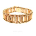 An 18 ct yellow gold, chunky, various-linked bracelet