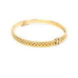 An elegant, 9 ct yellow gold, textured bangle