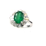 A fabulous, Art Deco style, large emerald and diamond cluster ring