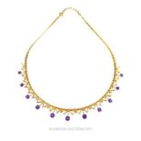 A 15 ct yellow gold necklace set with amethyst drops