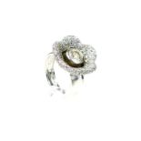 A unique, large, 14 ct white gold, flower head ring, studded with zircons