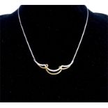 An elegant, 9 ct yellow and white gold, contemporary, diamond necklace