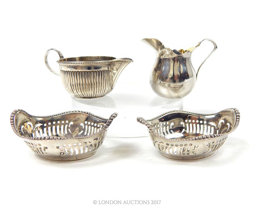 A pair of American Gorham sterling sterling silver nut dishes and two cream jugs