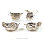 A pair of American Gorham sterling sterling silver nut dishes and two cream jugs