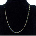 A fine, 14 ct yellow gold and sapphire-set chain necklace