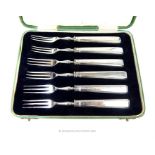 A cased set of six sterling silver handled dessert forks