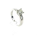 A fine, 18 ct white gold, diamond solitaire ring with diamond set shoulders