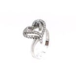 A charming, 18 ct white gold and diamond heart ring