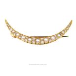 An antique, 18 ct yellow gold, crescent brooch set with grey pearls and diamonds