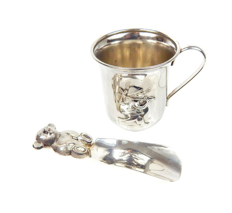 A sterling silver baby's rattle, with a WMF silver plated Christening mug