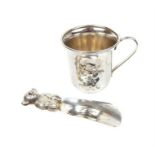 A sterling silver baby's rattle, with a WMF silver plated Christening mug