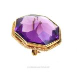 A Victorian, 15 ct yellow gold brooch set with a very large, natural, faceted amethyst