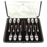 A cased set of twelve sterling silver coffee spoons and the matching sugar tongs
