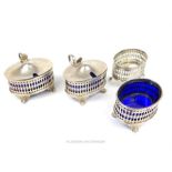A set of four sterling silver mustards and salts