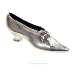 A sterling silver pin cushion in the form of a shoe