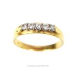 An18 ct yellow gold, five stone, diamond ring