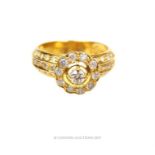 An 18 ct yellow gold, diamond-set, flower-head, cluster ring