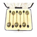 A cased set of six sterling silver gilt and enamelled coffee spoons