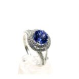 An 18 ct white gold, diamond and tanzanite dress ring