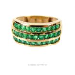 A handsome, 9 ct yellow gold, emerald, three row, ring